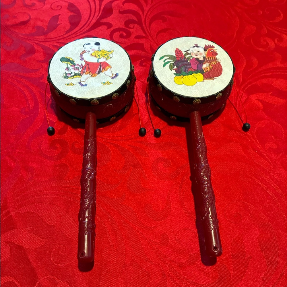 Red Handheld Drums with Decorative Prints